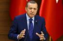 Turkish President Tayyip Erdogan makes a speech during his meeting with mukhtars at the Presidential Palace in Ankara