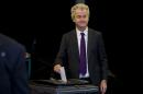 Firebrand Dutch lawmaker Geert Wilders casts his vote in a non-binding referendum on the EU-Ukraine association agreement in The Hague, Netherlands, Wednesday, April 6, 2016. The vote is seen by opponents of the 28-nation EU bloc as an opportunity to express their anger at what they consider unwanted expansionism and a lack of democratic rights for EU citizens.(AP Photo/Peter Dejong)