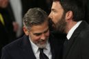 George Clooney, left, and Ben Affleck arrive for the BAFTA Film Awards at the Royal Opera House on Sunday, Feb. 10, 2013, in London. (Photo by Ki Price/Invision/AP)