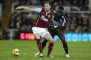 Burnley's English striker Ashley Barnes (L) vies with Newcastle United's Ivorian midfielder Cheick Tiote during a match in Newcastle-upon-Tyne, England, on January 1, 2015