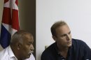 Swedish citizen Jens Aron Modig listens to a translator during a press conference in Havana, Cuba, Monday, July 30, 2012. Modig and Spanish citizen Angel Carromero who were traveling with Cuban dissident Oswaldo Paya when he died in a car crash are denying speculation that a second vehicle was involved. Modig backs up investigators' report that the driver braked abruptly after entering an unpaved construction zone and lost control. (AP Photo/Franklin Reyes)