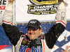 Tony Stewart celebrates with his crew in Victory Lane after winning the NASCAR Sprint Cup Series auto race at New Hampshire Motor Speedway, Sunday, Sept. 25, 2011, in Loudon, N.H. (AP Photo/Jim Cole)