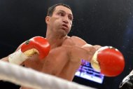 World heavyweight champion Vladimir Klitschko punches during his boxing fight on July 7, 2012 in Bern. Klitschko will defend his WBO, IBF and WBA belts against Poland's Mariusz Wach in Hamburg on November 10, it was announced on Wednesday. (AFP Photo/Fabrice Coffrini)