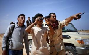 Libya Dawn fighters look at Islamic State militant &hellip;