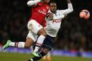 Arsenal's midfielder Serge Gnabry (L) clashes with Tottenham Hotspur's defender Danny Rose during an English FA cup third round football match at the Emirates Stadium in London on January 4, 2014