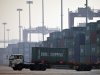 In this photo taken Tuesday, Feb. 28, 2012, a truck transports a container to be loaded onto a ship at a port in Tianjin, China. China says its trade rebounded in February after a Lunar New Year slowdown but a broader measure gave clear signs both global and Chinese demand are weakening. Customs data Saturday, March 10, 2012 showed exports grew 18.4 percent over a year earlier, up from January's 0.5 percent contraction. Imports jumped 39.6 percent, up from the previous month's decline of 15 percent. (AP Photo/Alexander F. Yuan)