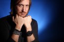 FILE - In this Dec. 8, 2011 file photo, music producer and DJ David Guetta poses for a portrait in New York. Guetta, who is from France, helped bring the electronic sound to America by collaborating with acts like the Black Eyes Peas, Kelly Rowland, Usher, Nicki Minaj, Akon and more. He has two Grammy Awards and six Top 40 hits on the Billboard Hot 100 chart. (AP Photo/Carlo Allegri, file)