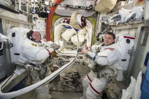 NASA photo of NASA astronauts Reid Wiseman and Barry Wilmore work inside the International Space Station