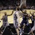 Memphis Grizzlies' Mike Conley (11) is defended by San Antonio Spurs' Matt Bonner, center, as he tries to score during the first half in Game 1 of a Western Conference Finals NBA basketball playoff series Sunday, May 19, 2013, in San Antonio. (AP Photo/Eric Gay)