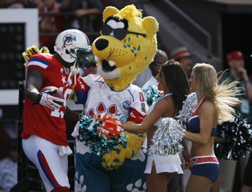 AFC's Marshall of the Miami Dolphins celebrates with an NFL mascot and cheerleaders during the NFL Pro Bowl at Aloha Stadium in Honolulu