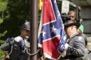 The Confederate battle flag is permanently removed from the South Carolina statehouse grounds during a ceremony in Columbia