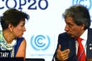 UNFCCC Executive Secretary Christiana Figueres (L) listens to the COP20 President and Peruvian Minister of Environment Manuel Pulgar on December 12, 2014 in Lima