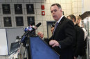 In this Feb. 26, 2013 file photo, Chicago Police Superintendent Garry McCarthy stands near guns confiscated in Chicago and talks about the department's efforts to curb gun violence during a news conference in Chicago. As Illinois Gov. Pat Quinn mulls whether to sign off on eliminating the nation's last ban on public possession of guns, the question in Chicago is whether it will matter in the crime-weary city where a spiking murder rate drew national attention last year. McCarthy calls a requirement that people go through only 16 hours of training before they are issued a concealed carry permit "Incredibly troubling." (AP Photo/Charles Rex Arbogast, File)