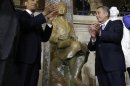 President Barack Obama and House Speaker John Boehner of Ohio applaud at the unveiling of a statue of Rosa Parks, Wednesday, Feb. 27, 2013, on Capitol Hill in Washington. (AP Photo/Charles Dharapak)