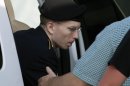 Army Pfc. Bradley Manning arrives at the courthouse in Fort Meade, Md., Monday, July 8, 2013, after the start of the sixth week of his court martial. Manning is charged with indirectly aiding the enemy by sending troves of classified material to WikiLeaks. He faces up to life in prison. ( AP Photo/Jose Luis Magana)