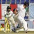 Pakistan's Akmal attempts unsuccessfully to stump England's Cook during the second cricket test match in Abu Dhabi