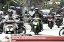 In this image made from Indonesian television TV One, people on motorcycles and cars flee after a strong earthquake hit in Aceh in Indonesia, Wednesday, April 11, 2012. A tsunami watch was issued for countries across the Indian Ocean after a large earthquake hit waters off Indonesia on Wednesday, triggering widespread panic as residents along coastlines fled to high ground in cars and on the backs of motorcycles. (AP Photo/TV One via AP Video) INDONESIA OUT