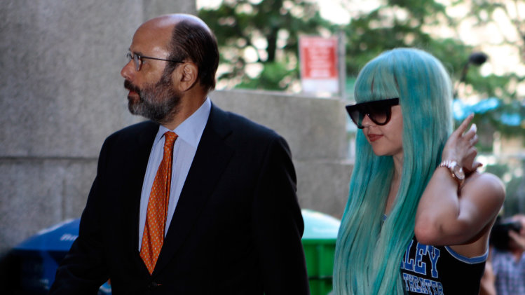 FILE - In a Tuesday, July 9, 2013 file photo, Amanda Bynes, accompanied by attorney Gerald Shargel, arrives for a court appearance in New York on allegations that she chucked a marijuana bong out the window of her 36th-floor Manhattan apartment. Bynes has been hospitalized for a mental health evaluation after deputies said she started a small fire in the driveway of a home in Southern California. Ventura County sheriff's Capt. Don Aguilar says deputies responding to a call Monday night, July 22, 2013 found Bynes standing next to the flames in the city of Thousand Oaks, Calif. The deputies determined she met the criteria for a mental health hold and took her into custody. She can be held for up to 72 hours of observation. (AP Photo/Bethan McKernan, File)
