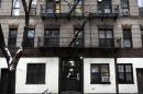The building at 320 Mott St. is seen in New York, Wednesday, Feb. 5, 2014. Four people are in custody on drug charges after police executed search warrants at three apartments in the building. (AP Photo/Seth Wenig)