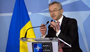 Ukraine's Ambassador to NATO Ihor Dolhov adjusts …