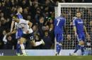 Chelsea players stand dejected as Tottenham's Nacer Chadli celebrates scoring a goal during the English Premier League soccer match between Tottenham Hotspur and Chelsea at White Hart Lane Stadium in London, Thursday, Jan. 1, 2015. (AP Photo/Kirsty Wigglesworth)
