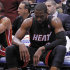 Miami Heat's Dwyane Wade sits on the bench with his shoe off during the second half of an NBA basketball game against the Utah Jazz in Salt Lake City, Friday, March 2, 2012. The Jazz Beat the Heat 99-98. (AP Photo/George Frey)