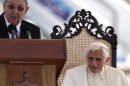 Pope Benedict XVI (R) listens to a speech by Cuban President Raul Castro