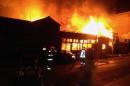 Firefighters try to extinguish a fire at a restaurant after a powerful earthquake hit off Chile's Pacific coast, on April 1, 2014 in Iquique