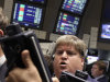 FILE - In this Aug. 16, 2011 file photo, traders work on the floor of the New York Stock Exchange. European stocks failed to keep up with gains in Asia on Thursday, Sept. 1, 2011, as downbeat reports on the manufacturing sector darkened investors' moods. (AP Photo/Richard Drew, File)