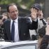 New French President Francois Hollande waves out of a sunroof as he rode up the Champ-Elysses avenue after the presidential handover ceremony, Tuesday, May 15, 2012 in Paris.  Hollande became president of France on Tuesday in a ceremony steeped in tradition, taking over a country with deep debts and worried about Europe's future and pledging to make it a fairer place.  (AP Photo/Michel Euler)