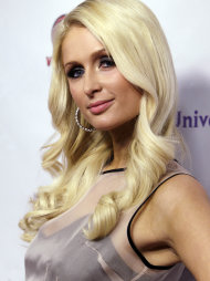 FILE - In this June 15, 2011 file photo, Paris Hilton arrives at the NBC Universal VIP party during the Cable Show in Chicago. Los Angeles prosecutors charged James Rainford, 36, with violating a court order to stay away from Hilton and he is expected to be arraigned Tuesday, July 5, on the misdemeanor charge. (AP Photo/Nam Y. Huh, file)