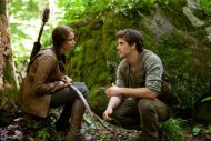 FILE - In this file image released by Lionsgate, Jennifer Lawrence portrays Katniss Everdeen, left, and Liam Hemsworth portrays Gale Hawthorne in a scene from "The Hunger Games." "The Hunger Games" on Monday, April 30, 2012 was nominated for eight MTV Movie awards, including bids for best cast, breakthrough performance, and movie of the year. (AP Photo/Lionsgate, Murray Close, File)