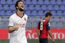 Roma's Mattia Destro celebrates after scoring during a Serie A soccer match between Cagliari and Roma in Cagliari, Italy, Sunday, April 6, 2014. Roma moved within five points of Serie A leader Juventus as Mattia Destro scored his first-ever hat trick in a 3-1 win at Cagliari on Sunday. (AP Photo/Max Solinas)