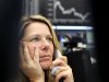 A trader makes a phone call at the stock market in Frankfurt, Germany, Tuesday, Nov. 15, 2011, where the curve of the German stock index went down in the morning but went up again in the afternoon.(AP Photo/Michael Probst)