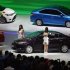 Models pose by Toyota cars during the 15th Shanghai International Automobile Industry Exhibition in Shanghai