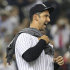 New York Yankees' Jorge Posada reacts while celebrating with teammates after the Yankees clinched the AL East title with a 4-2 win over the Tampa Bay Rays in the second game of a baseball doubleheader Wednesday, Sept. 21, 2011, in New York. (AP Photo/Frank Franklin II)
