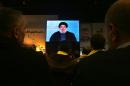 Hezbollah leader Sheikh Hassan Nasrallah, speaks via video link to his supporters during a ceremony marking the death of six Hezbollah fighters and an Iranian general who were killed in an Israeli airstrike in Syria's Golan Heights last week, in the southern suburb of Beirut, Lebanon, Friday, Jan. 30, 2015. Nasrallah said his group will no longer abide by any rules of engagements suggesting he has the right to retaliate to any future Israeli attack at the place and time Hezbollah choses. (AP Photo/Bilal Hussein)