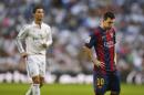 Real Madrid's Cristiano Ronaldo, left, runs as Barcelona's Lionel Messi, gestures during a Spanish La Liga soccer match between Real Madrid and FC Barcelona at the Santiago Bernabeu stadium in Madrid, Spain, Saturday, Oct. 25, 2014. (AP Photo/Andres Kudacki)