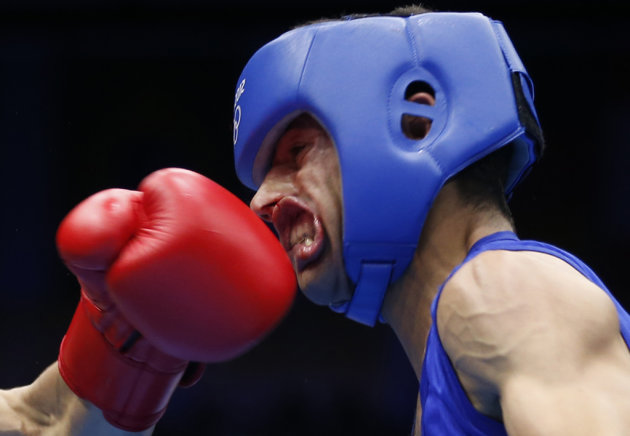 Oubaali of France fights against Afghanistan&#39;s Faisal in the men&#39;s Fly (52kg) Round of 32 boxing match during the London 2012 Olympic Games