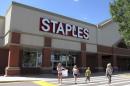 A family leaves the Staples store in Broomfield