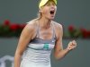 Sharapova of Russia celebrates winning a game against Navarro of Spain during their match at the BNP Paribas Open WTA tennis tournament in Indian Wells