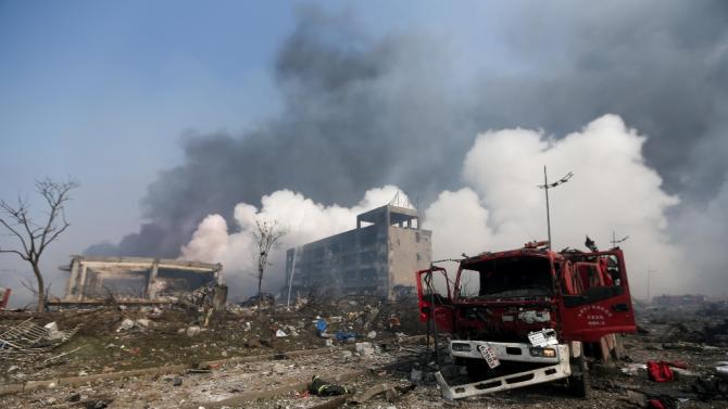 A damaged fire truck is seen at the site of the massive explosions in Tianjin on August 13, 2015