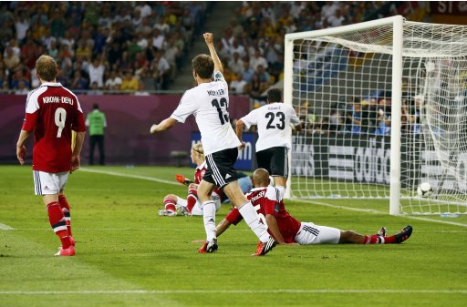 Germany's Mueller and Germany's Gomez celebrate a goal against Denmark during their Euro 2012 Group B soccer match at the New Lviv stadium in Lviv