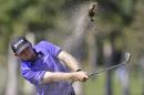 J.B. Holmes hits a shot on the sixth fairway during the second round of the Cadillac Championship golf tournament, Friday, March 6, 2015, in Doral, Fla. (AP Photo/Wilfredo Lee)