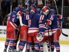 Members of the New York Rangers celebrate after defeating the Ottawa Senators 2-1 in Game 7 of a first-round NHL hockey Stanley Cup playoff series on Thursday, April 26, 2012, in New York. (AP Photo/Julio Cortez)