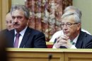 Luxembourg's Foreign Minister Jean Asselborn and Prime Minister Jean-Claude Juncker attend a session at the Luxembourg Parliament in Luxembourg