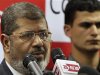 Muslim Brotherhood's presidential candidate Mohamed Morsy addresses a news conference in Cairo