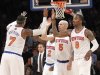 New York Knicks' Carmelo Anthony (7) high fives team mates Raymond Felton (2) Jason Kidd (5) and J.R. Smith (8) during the first half of an NBA basketball game against the Washington Wizards, Tuesday, April 9, 2013, at Madison Square Garden in New York.  (AP Photo/Mary Altaffer)