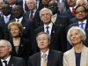 Germany's Schaeuble, Swiss Widmer-Schlumpf, China's Zhou Xiaochuan, Russia's Ignatyev, IMF Managing Director Lagarde, and India's Chidambaram take their places for an IMF governors group photo in Washington