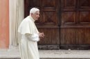 Pope Benedict XVI visits the damaged church of St. Catherine of Alexandria in Rovereto di Novi